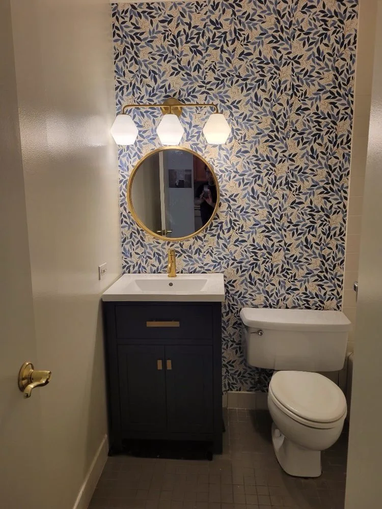 Deep blue accent wall with picture rail molding